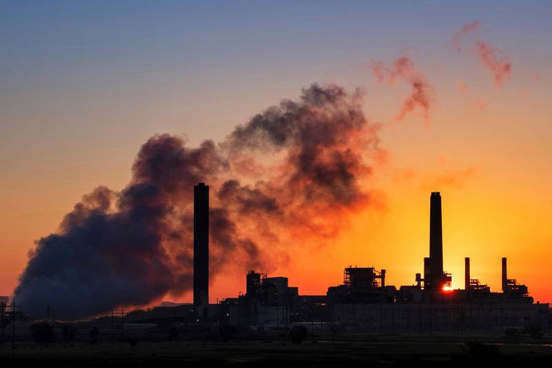 FILE - In this July 27, 2018, file photo, the Dave Johnson coal-fired power plant is silhouetted against the morning sun in Glenrock, Wyo. The Trump administration on Friday targeted an Obama-era regulation credited with helping dramatically reduce toxic mercury pollution from coal-fired power plants, saying the benefits to human health and the environment may not be worth the cost of the regulation. The 2011 Obama administration rule, called the Mercury and Air Toxics Standards, led to what electric utilities say was an $18 billion clean-up of mercury and other toxins from the smokestacks of coal-fired power plants. (AP Photo/J. David Ake, File)