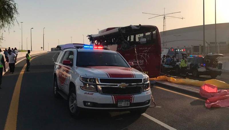 This image released by Dubai Police Headquarters shows the aftermath of a bus crash on Friday, June 7, 2019, in Dubai, United Arab Emirates. The bus, from Oman, smashed into a warning sign coming off a major highway killing more than a dozen people, including Indian citizens, authorities said. (Dubai Police HQ via AP)