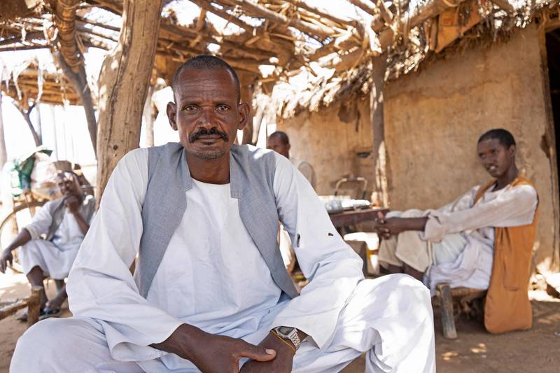 Ohaj Soliman, a 43-year-old Sudanese day labourer who put his children to work, poses for a picture during an interview with AFP in the village of Gosla in Sudan's eastern state of Kassala, on September 27, 2022.  There are nearly seven million children in Sudan who no longer go to school, a victim of what aid agencies have warned is a "generational catastrophe".  Children in the country have for years faced mounting difficulties gaining access to proper education, especially in rural areas.  Sudan is already one of the world's poorest countries, plagued by political instability, droughts, hunger and conflict, with an adult literacy rate of only around 60 percent according to the World Bank. AFP