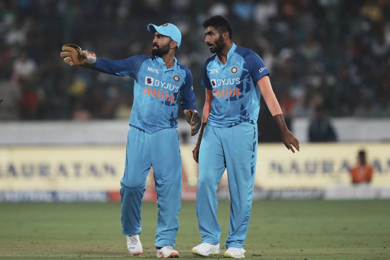 India's Jasprit Bumrah, right, discusses field placing with wicketkeeper Dinesh Karthik in Hyderabad. AP