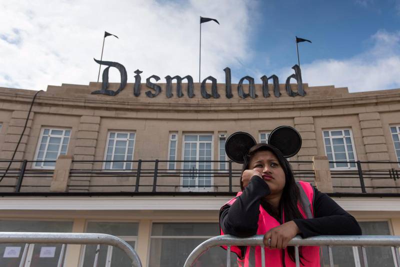 A steward is seen outside Bansky's 'Dismaland' exhibition, which opened at a derelict seafront lido in Weston-Super-Mare, England. Getty Images