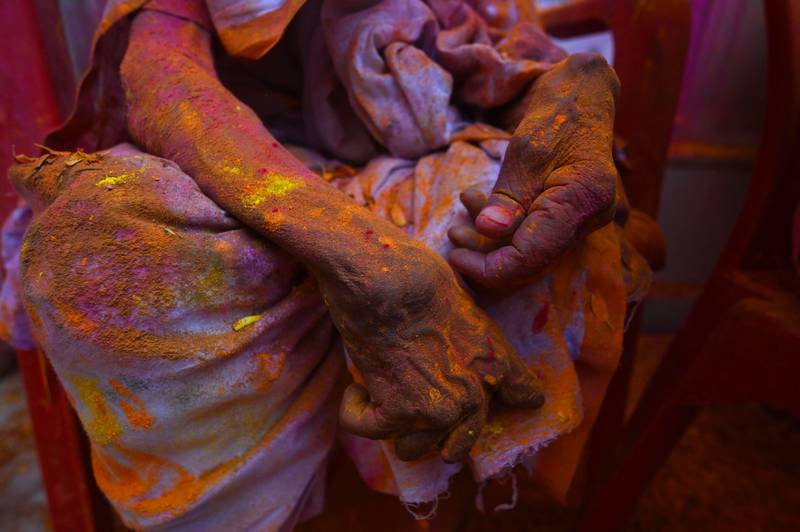 A widow sits in a temple as she participates in Holi celebrations in Vrindavan. AFP