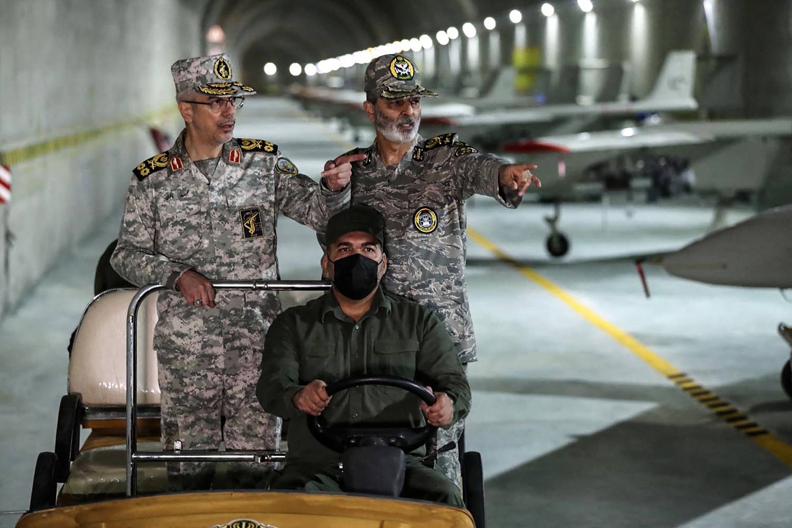 Maj Gen Mohammad Bagheri, left, Iran's Armed Forces Chief of Staff, and Maj Gen Abdolrahim Mousavi, Army Commander-in-Chief, visit an underground drone base at an undisclosed location in Iran. AFP