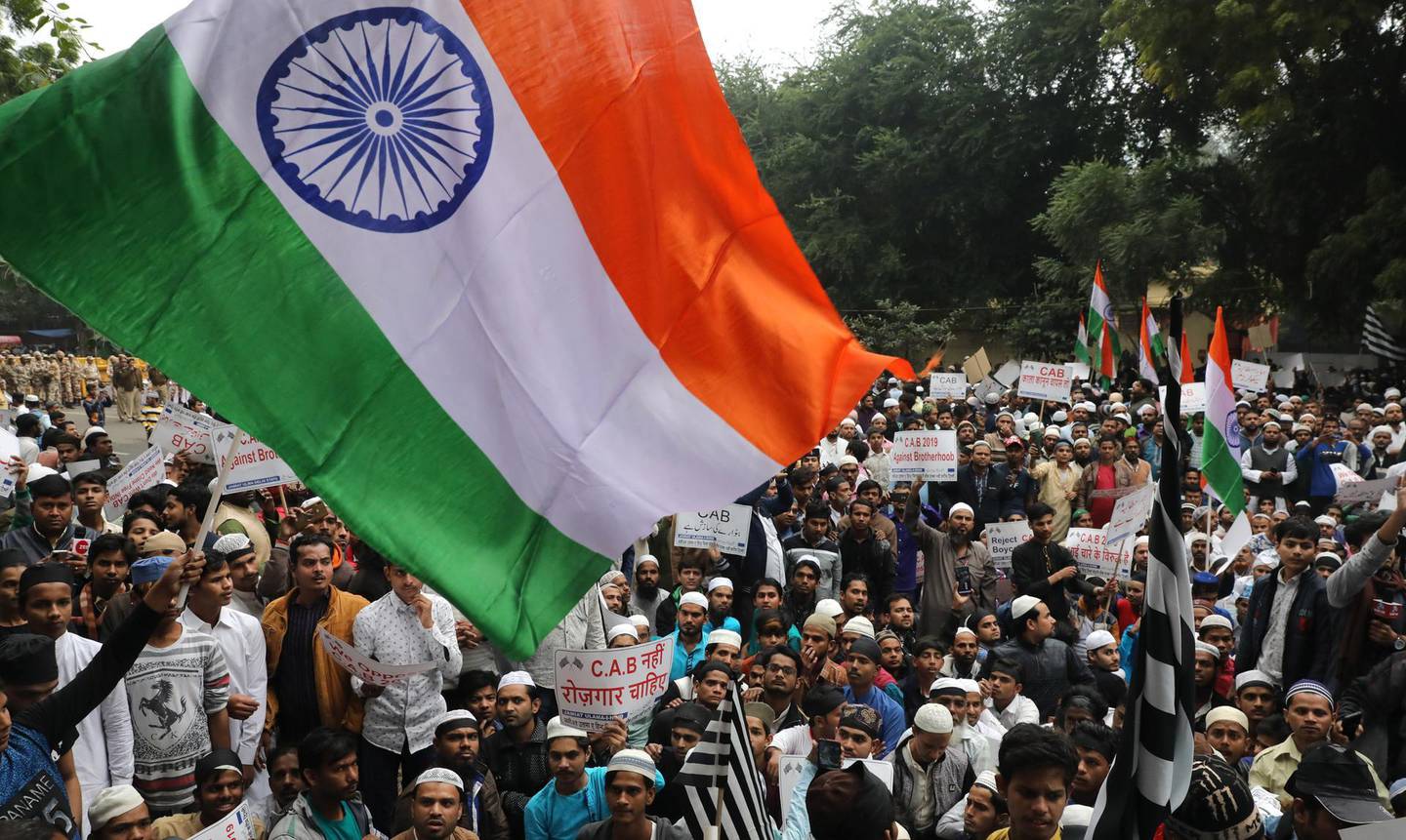 epa08069051 Indian Muslims from Jamiat Ulema-e-Hind take part in a protest against the Citizenship (Amendment) Bill 2019 (CAB) in New Delhi, India, 13 December 2019. The bill will give Indian citizenship rights to refugees from Hindu, Jain, Buddhist, Sikhs, Parsi or Christian communities coming from Afghanistan, Bangladesh and Pakistan.  EPA/RAJAT GUPTA