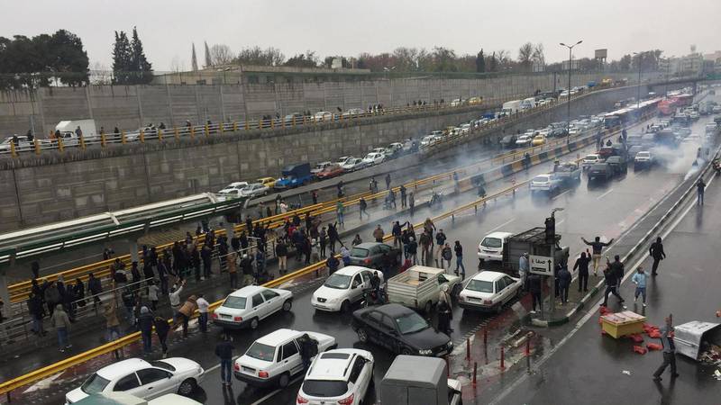 People stop their cars on a road in Tehran, Iran, on November 16, 2019, in protest against fuel price rises. Wana