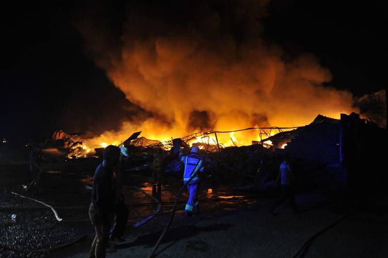 It took the firemen four hours to battle the blaze because of the high temperatures and the flammable materials stored at the carpet and furniture shops in the area.