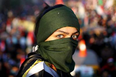 An Iraqi female demonstrator takes part in ongoing anti-government protests in Baghdad, Iraq. Reuters