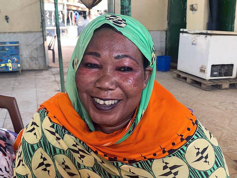This August 18, 2019 photo shows Basmat Adam, 41, who is one of the thousands of women who sell tea on the sidewalks of Khartoum, Sudan’s capital, and are fondly known as the “tea ladies.” Mrs Adam is a native of Wad Madani in central Sudan. Photo by Hamza Hendawi for The National