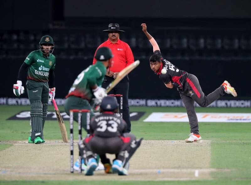 UAE's Aayan Afzal Khan bowls during the T20 international against Bangladesh in Dubai. Chris Whiteoak / The National