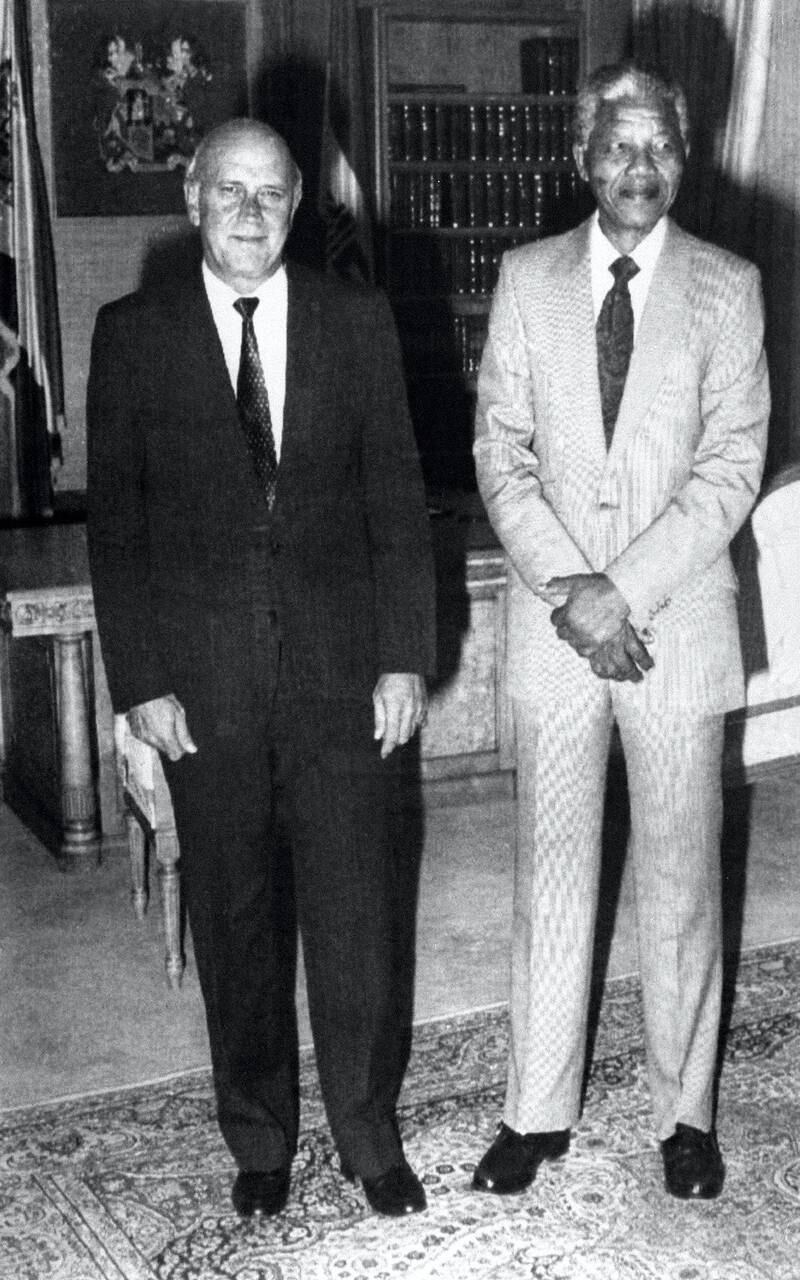 South Africa's president Frederik W. De Klerk (L) poses with the world most famous prisoner anti-apartheid leader and African National Congress (ANC) member Nelson Mandela, in Cape Town's government residence, 09 February 1990, two days before his release from jail. Frederik de Klerk announced Nelson Mandela his release from jail.