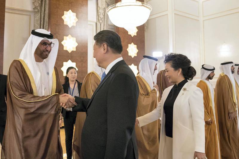 ABU DHABI, UNITED ARAB EMIRATES - July 19, 2018: HE Dr Sultan Ahmed Al Jaber, UAE Minister of State, Chairman of Masdar and CEO of ADNOC Group (L) greets HE Xi Jinping, President of China (2nd L), during a reception held at the Presidential Airport. Seen with Peng Liyuan, First Lady of China (R).

( Mohamed Al Hammadi / Crown Prince Court - Abu Dhabi )
---