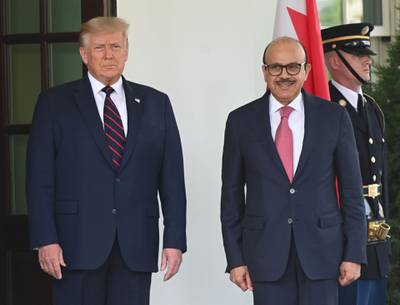 US President Donald Trump welcomes Bahraini Foreign Minister Abdullatif Al Zayani on the North Lawn of the White House in Washington, DC. AFP