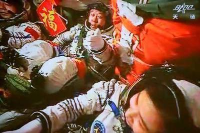 The Chinese astronauts Jing Haipeng, Liu Wang and Liu Yang took part in their country's third manned space mission last week when their Shenzhou-9 spacecraft docked with the Tiangong-1 space lab 343 kilometres above Earth. The mission was widely celebrated in China as fulfilling a prediction by Mao Zedong. Beijing Aerospace Control Centre / Xinhua /AP