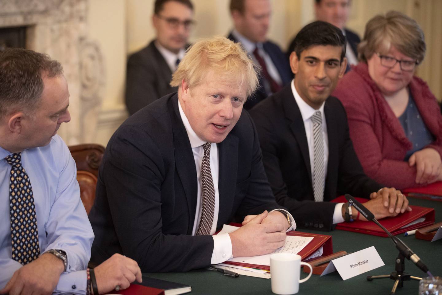 Boris Johnson speaks during his first Cabinet meeting flanked by his then new Chancellor of the Exchequer Rishi Sunak, in London, on February 14, 2020. AP