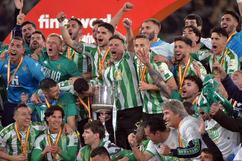 Real Betis players celebrate with the Copa del Rey after winning the trophy. AFP