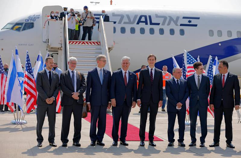 Senior White House adviser Jared Kushner and US National Security Adviser Robert O'Brien pose with members of the US-Israel delegation before boarding the El Al's flight. AP
