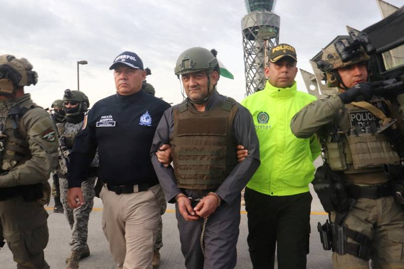 Colombian drug trafficker Dairo Antonio Usuga David, also known as 'Otoniel', is escorted by police after Colombia extradites him to the US. Reuters