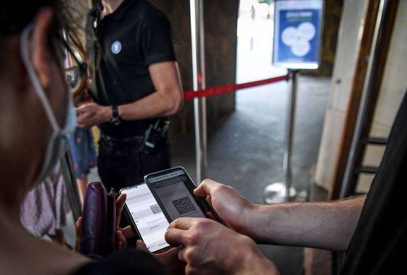 A health passport is checked at the entrance to the Grand Rex cinema in Paris. AFP