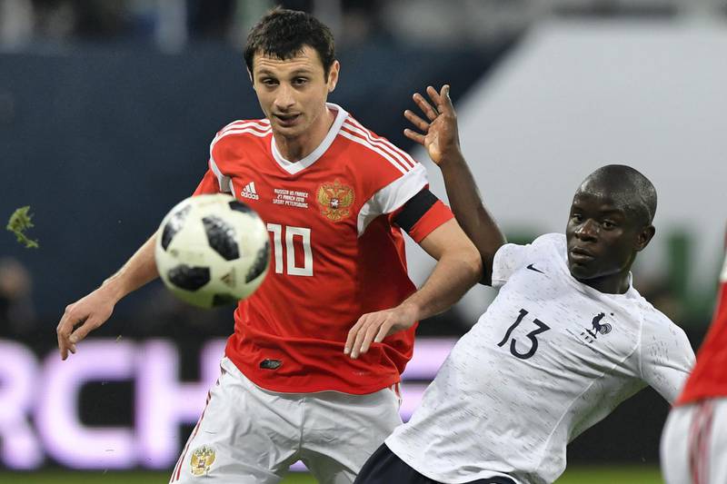 Russia's midfielder Alan Dzagoev and France's midfielder N'golo Kante vie for the ball during an international friendly football match between Russia and France at the Saint Petersburg Stadium in Saint Petersburg on March 27, 2018. / AFP PHOTO / Kirill KUDRYAVTSEV