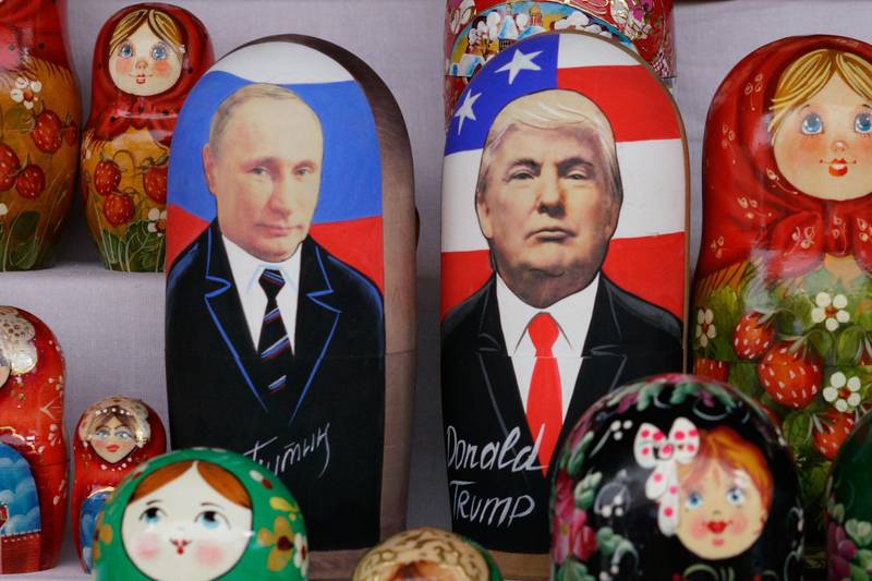 Russian Matryoshka dolls depicting Russian President Vladimir Putin and US President Donald Trump are seen on sale at Izmailovo flea market in Moscow on July 13, 2018, three days before the meeting of Russian President Vladimir Putin and US President Donald Trump to be held in Helsinki. / AFP / Maxim Zmeyev
