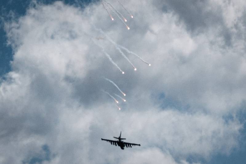 A Ukrainian Sukhoi Su-25 fighter jet releases decoy flares as it provides air support to troops on the ground near Yampil, eastern Ukraine. AFP