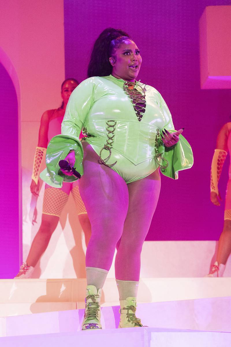 Lizzo performs in lime green and hot pink at the Outside Lands Music Festival on October 30, 2021. AP