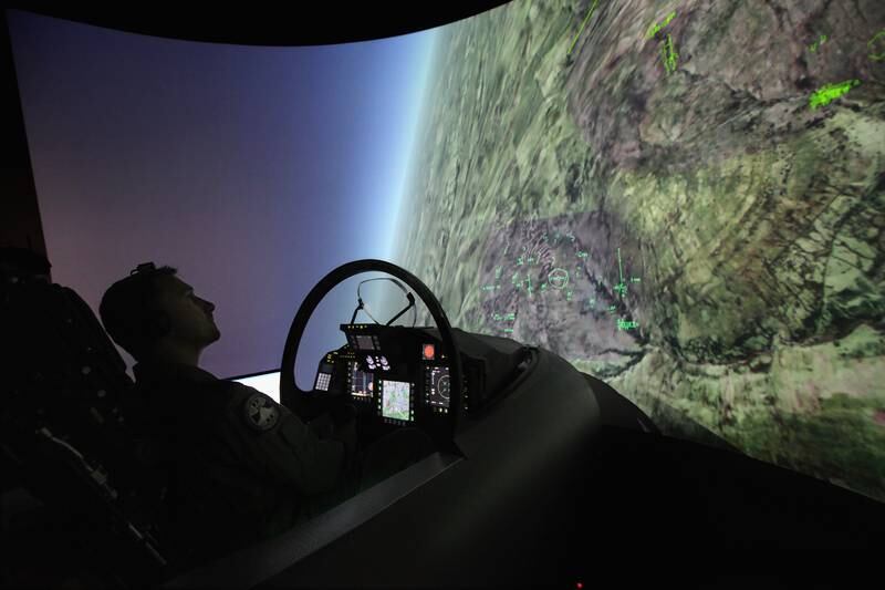 An member of the Italian Air Force crew demonstrates the capabilities of the Typhoon Eurofighter during a flight simulation at Farnborough Airshow in 2010.