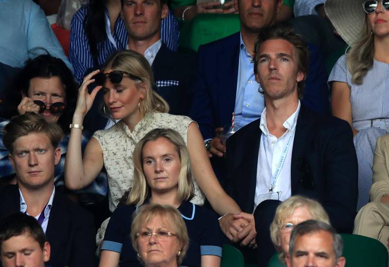 Poppy Delevingne and James Cook on day seven of the Wimbledon Championships at the All England Lawn Tennis and Croquet Club. PA