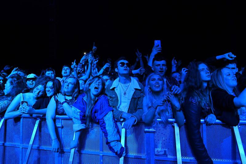 Fans watch Blossom perform at a live music concert  in Sefton Park in Liverpool, where a non-socially-distanced crowd of 5,000 are expected to attend. AFP