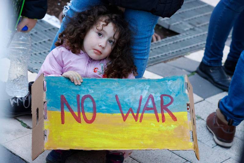 A girl protests against Russia's military operation in Ukraine, in front of the Russian embassy in Tel Aviv. AFP