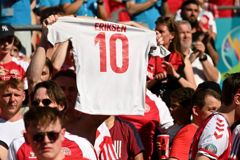 Denmark fans in the stands with a Christian Eriksen jersey. Reuters