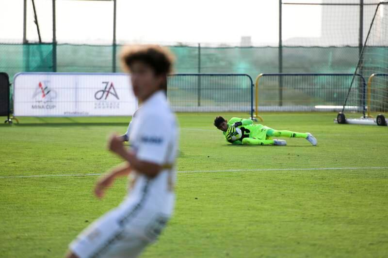 The Pumas Unam goalkeeper makes a save. 