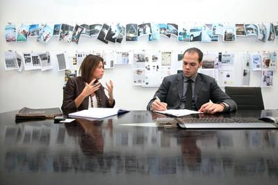 DUBAI, UNITED ARAB EMIRATES - DECEMBER 8:  Camilla d'Abo (L), managing partner, and Jamal al Mawed (R), account manager, d'pr, discuss a work project at their offices in Dubai on December 8, 2010.  (Randi Sokoloff for The National)  For Business Sector story by Ben Flanagan