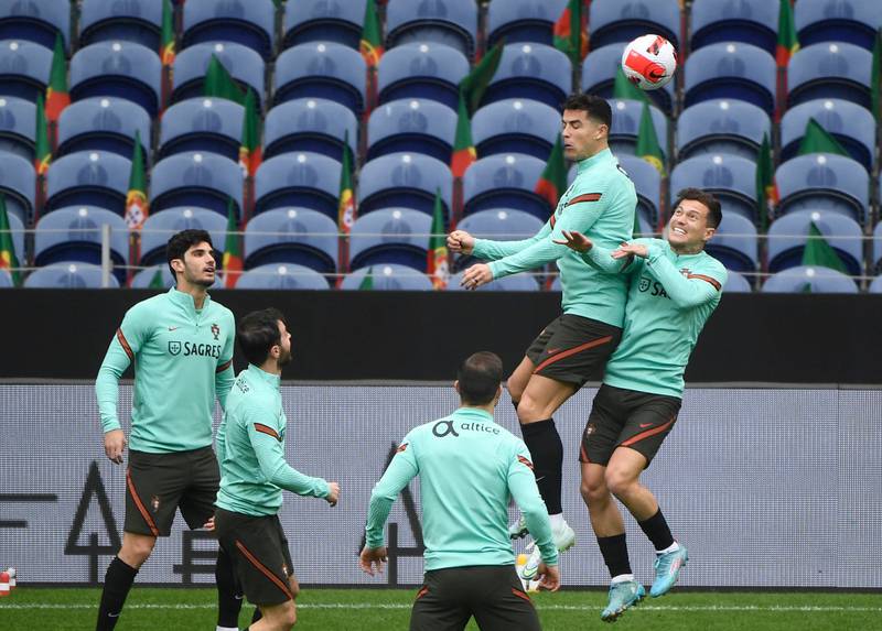 Cristiano Ronaldo and midfielder Otavio Monteiro battle for the ball at Portugal training. AFP