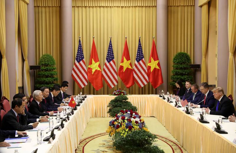 Vietnamese President Nguyen Phu Trong (third left) speaks during a meeting with US President Donald Trump at the Presidential Palace in Hanoi, Vietnam. Reuters