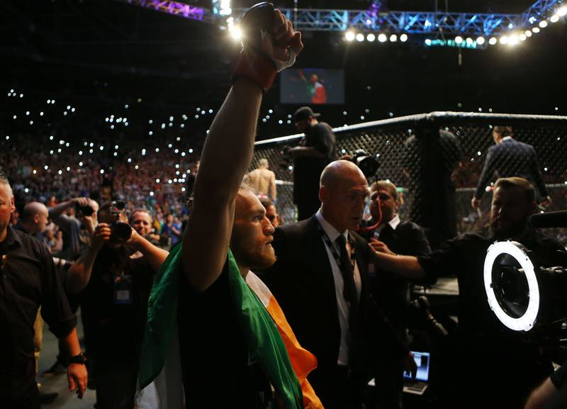 Conor McGregor leaves the ring after beating Brazil's Diego Brandao in their featherweight bout at the UFC Fight Night at the O2 in Dublin.