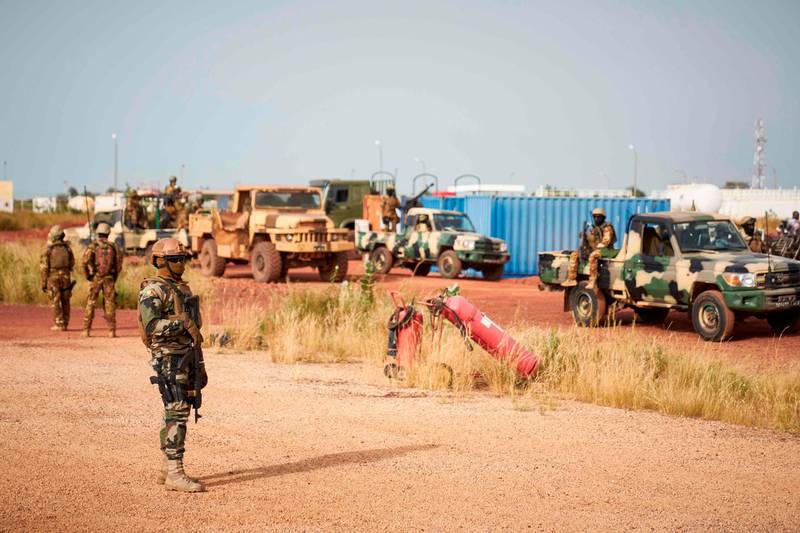 (FILES) In this file photo taken on October 14, 2018 Malian soldiers secure the airport of Mopti ahead of the arrival of Malian Prime Minister Soumeylou Boubeye Maiga. Fifty-three soldiers were killed on November 1, 2019, in a "terrorist attack" on a Mali military post in the northeast of the country.
The assault is one of the deadliest strikes against Mali's military in recent Islamist militant violence. / AFP / MICHELE CATTANI
