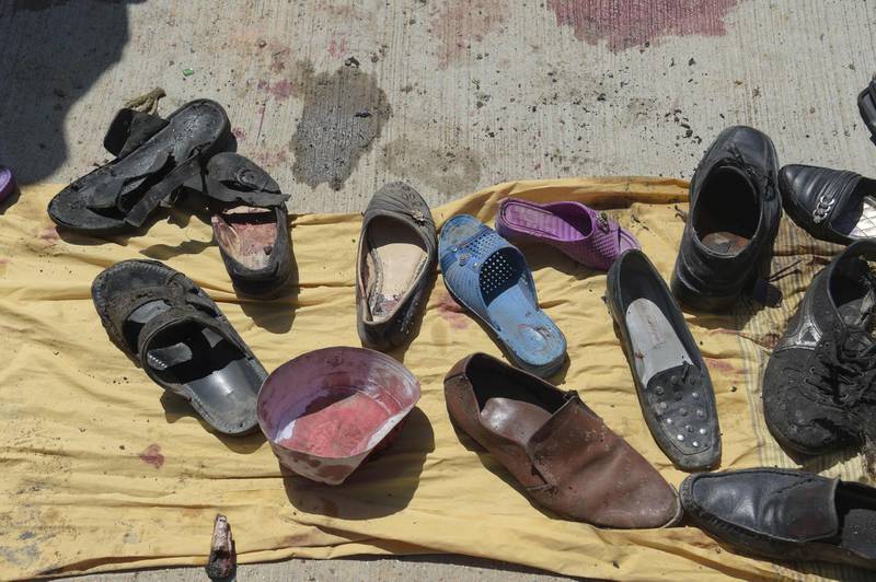 Abandoned shoes belonging to Afghan victims of a suicide bombing lie at the scene of the attack outside a voter registration centre in Kabul on April 22, 2018. Shah Marai / AFP
