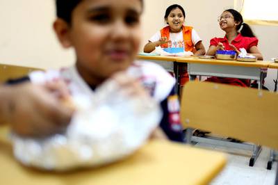 September 21, 2010 / Abu Dhabi / (Rich-Joseph Facun / The National)  Students at the Private International English School eat their lunches Tuesday, September 21, 2010 in Mussafah.  The school requires that each student only bring vegetarian friendly food to school. 
