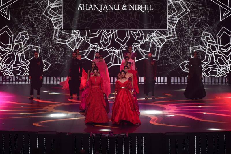 Models present looks by designer Nikhil and Shantanu on stage during the IIFA Rocks. Photo: AFP