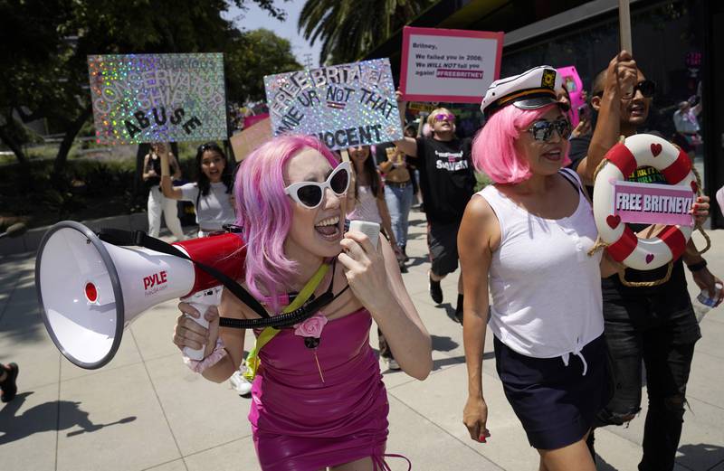 Britney Spears supporters Melanie Mandarano, left, of New York and Kiki Norberto of Phoenix, Ariz. , lead a march around the Stanley Mosk Courthouse, where a hearing concerning the pop singer's conservatorship was taking place.