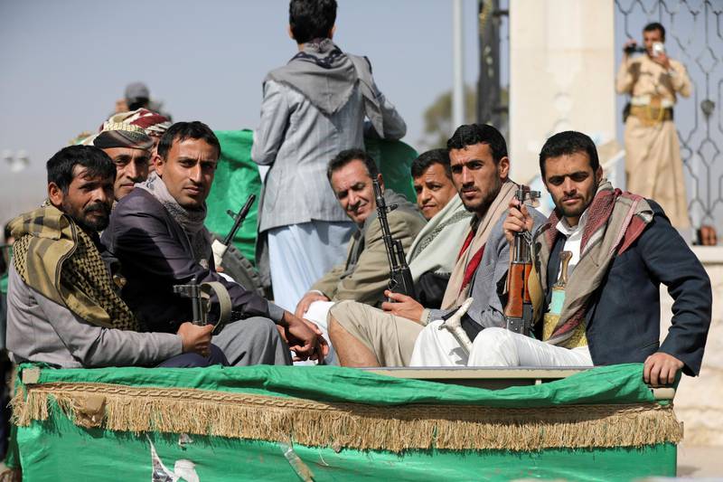 FILE PHOTO: Armed Houthi followers ride on the back of a truck after participating in a funeral of Houthi fighters killed in recent fighting against government forces in Yemen's oil-rich province of Marib, in Sanaa, Yemen February 20, 2021. REUTERS/Khaled Abdullah/File Photo/File Photo