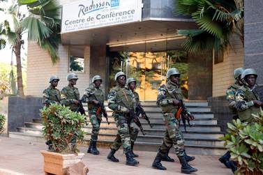 Soldiers from the presidential guard patrol outside the Radisson Blu hotel in Bamako  in 2015. AP