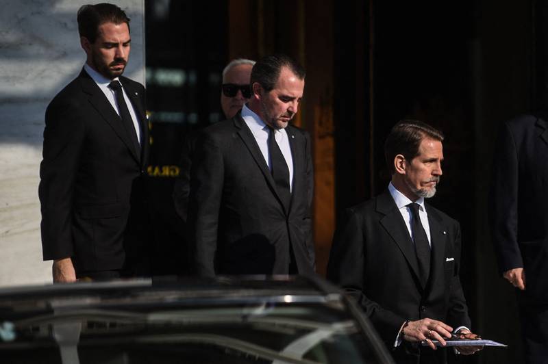 Former princes Nikolaos, Pavlos and Philippos of Greece at the funeral of their father in Athens. AFP