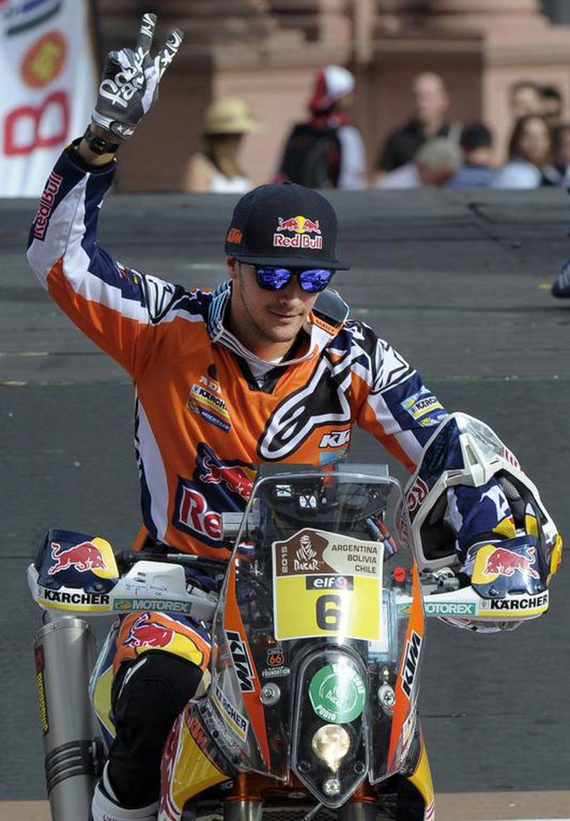 British biker Sam Sunderland waves from his KTM on the podium during the symbolic start of the 2015 Dakar Rally in Buenos Aires on Sunday. Alejandro Pagni / AFP