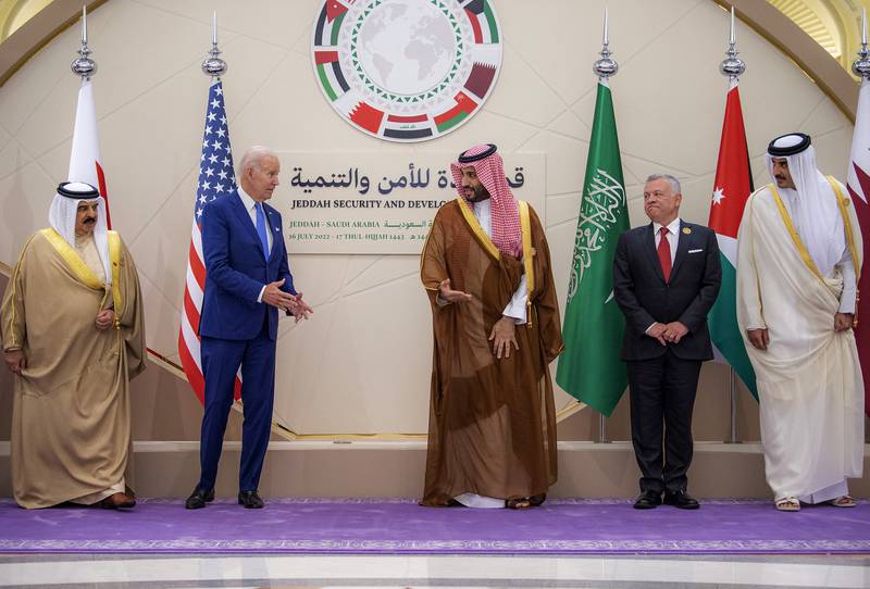 Mr Biden and Saudi Crown Prince Mohammed bin Salman motion towards each other during a family photo at the Jeddah Security and Development Summit. AFP