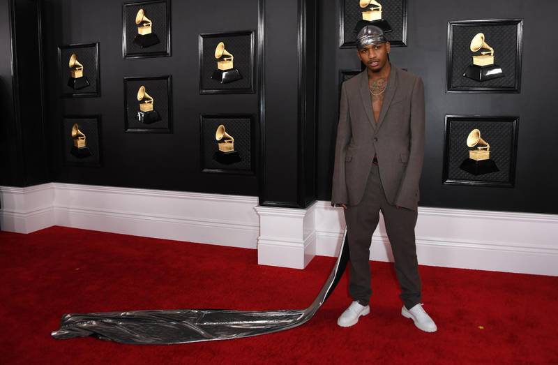 US musician Mustard arrives for the 62nd Annual Grammy Awards wearing a trailing metallic headscarf. AFP