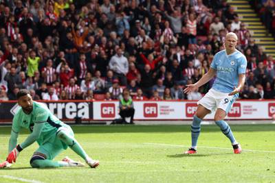 Manchester City's Erling Haaland reacts after hitting the post with his penalty. AFP