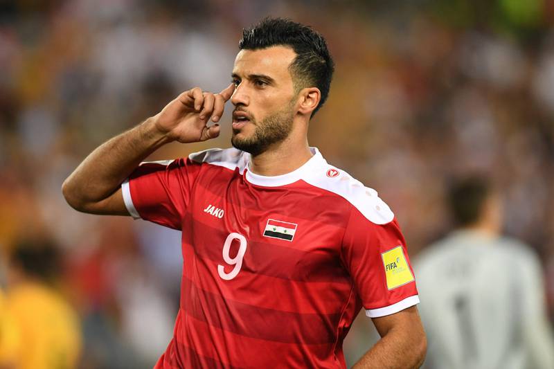 Syria's Omar Alsoma celebrates after scoring his side's first goal. Dean Lewins / EPA