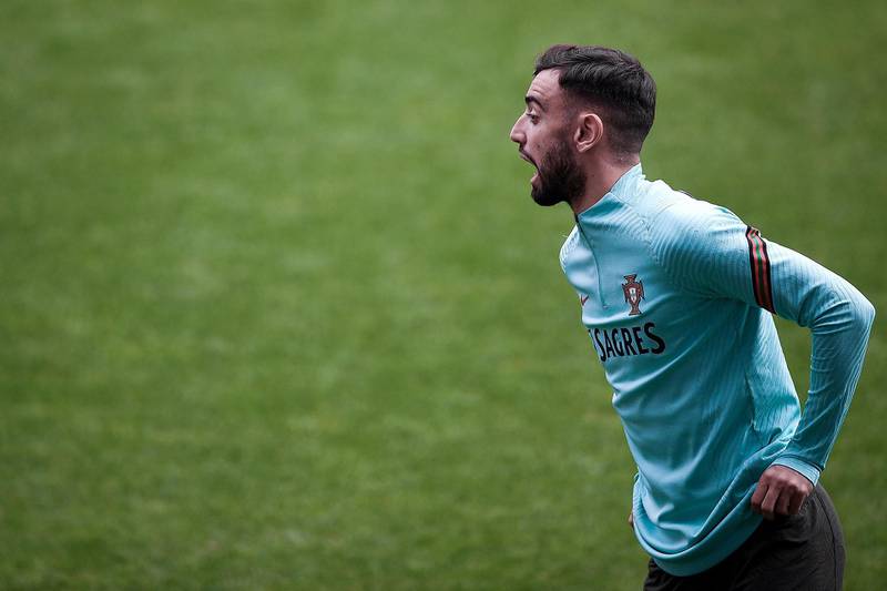 Portugal's midfielder Bruno Fernandes shouts during a training session. AFP